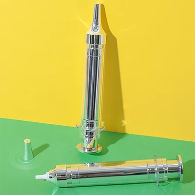 Envase airless tipo jeringa con boquilla de precisión