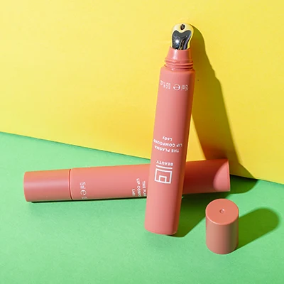 Tubo rosa de bálsamo labial de 15 ml con aplicador de zinc – vista de producto